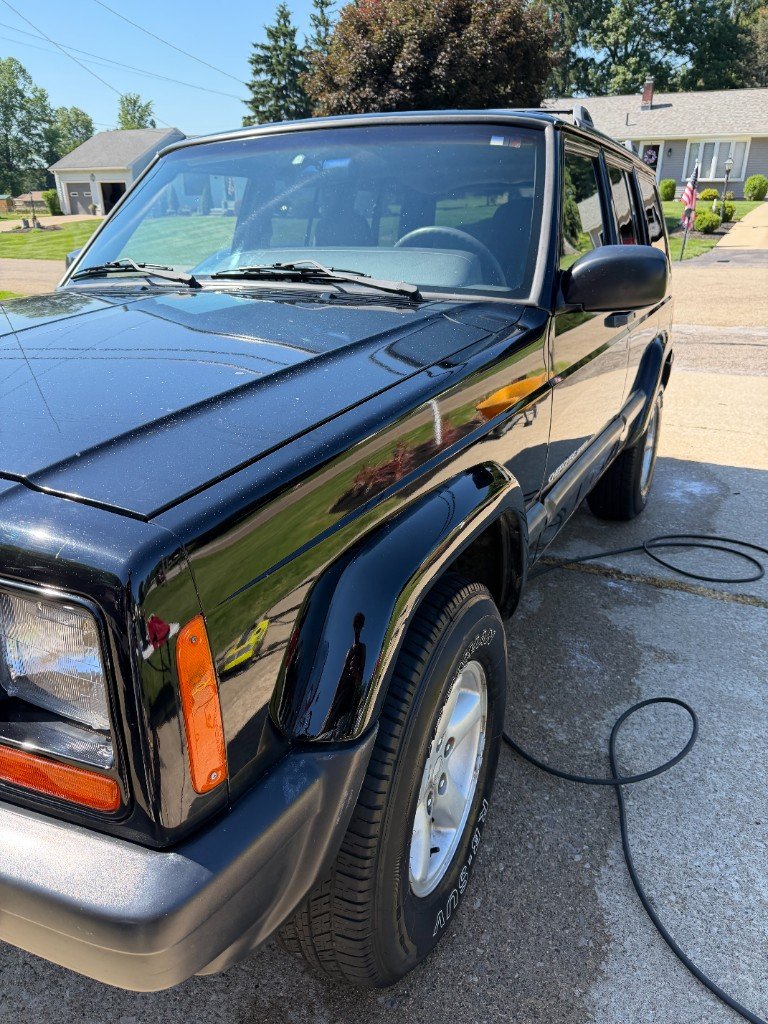 Glossy black Jeep Cherokee after exterior detail